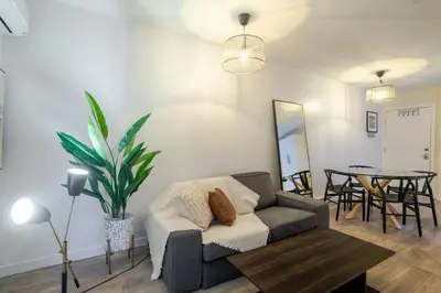a living room with a couch and a table at Beautiful 3BR in MTL Mont-Royal in Montréal