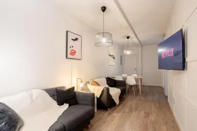 a living room with a couch and a table at Bright 3BR 2BA in the Plateau in Montréal
