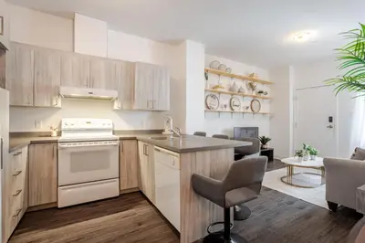 a kitchen with a sink and a stove top oven at Large Suite in Downtown Montreal in Montréal