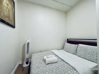 a bedroom with a bed with a pillow on it at Luxe Living Stay in Montréal