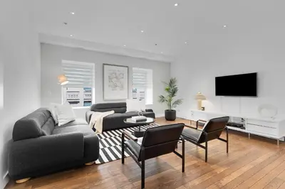 a living room with a couch and a tv at The SFX Old Port in Montréal
