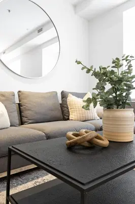 a black coffee table in a living room with a couch at The SFX Old Port in Montréal
