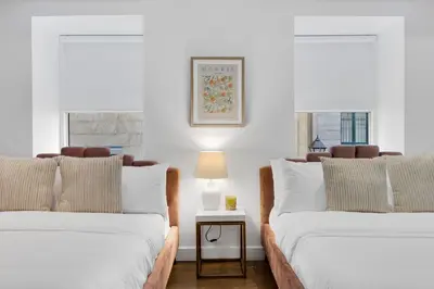 two beds sitting next to each other in a room at The SFX Old Port in Montréal