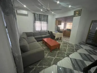 a living room with a couch and a coffee table at Cozy Home in Montréal