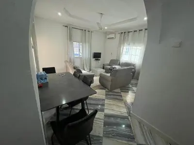 a living room with a table and a couch at Big Home in Montréal
