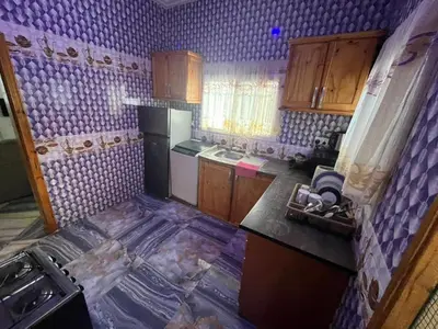 a small kitchen with a floor that is covered in water at Big Home in Montréal