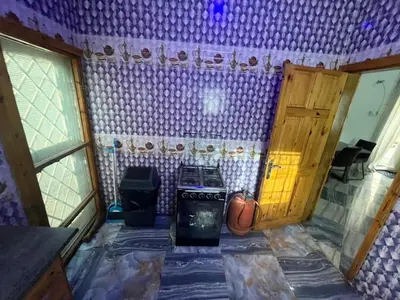an empty room with a basketball hoop and a door at Big Home in Montréal