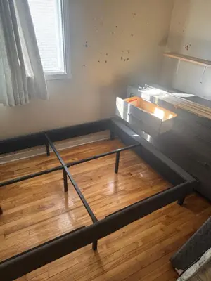 a room with a bunk bed with a wooden floor at Chambre a louer in Montréal