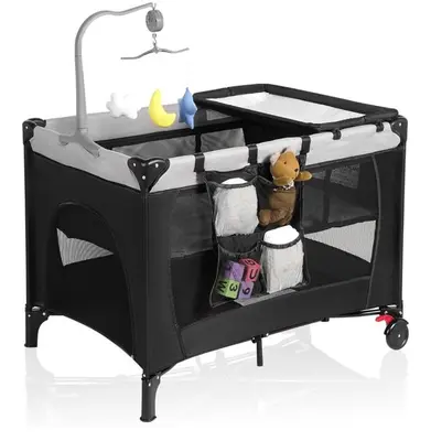 a black play cart with a teddy bear in it at Grande maison moderne 4 chambres - Spa Jaccuzi, Jardin & Parking gratuit - Idéale Familles et groupes in Saint-Jean-sur-Richelieu