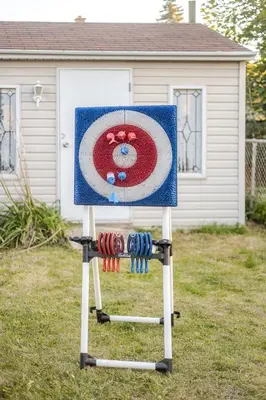 a painting of a hello kitty on a sign in a yard at Grande maison moderne 4 chambres - Spa Jaccuzi, Jardin & Parking gratuit - Idéale Familles et groupes in Saint-Jean-sur-Richelieu