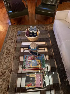 a living room with a glass coffee table at Authentic Spacious 1BDR In Downtown Montreal in Montréal
