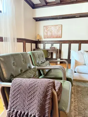 a living room with two chairs and a couch at Authentic Spacious 1BDR In Downtown Montreal in Montréal