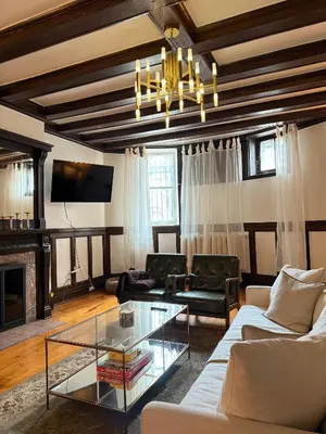 a living room with a couch and a glass table at Authentic Spacious 1BDR In Downtown Montreal in Montréal