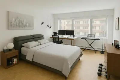 a bedroom with a bed and a desk with a computer at Golden Mile Luxe Apartment in Montréal