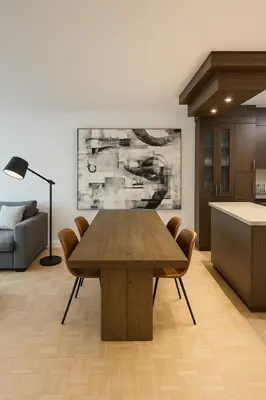 a dining room with a wooden table and chairs at Golden Mile Luxe Apartment in Montréal