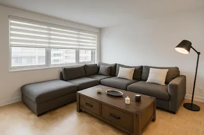 a living room with a couch and a coffee table at Golden Mile Luxe Apartment in Montréal