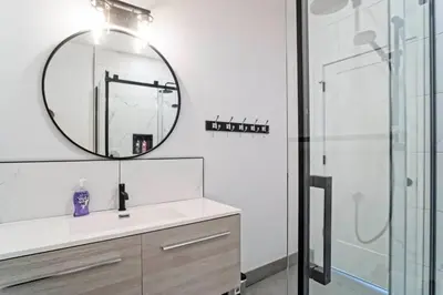 a bathroom with a sink and a mirror at 853 condo in Bromont Vieux Village mountain view in Bromont