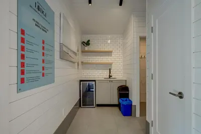 a laundry room with a sign on the wall at Most beautiful condo 101 in Bromont Vieux in Bromont