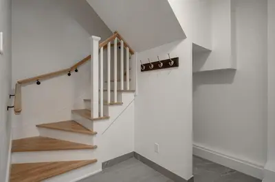 a staircase in a house with white walls at Loft at 913 Shefford in Bromont