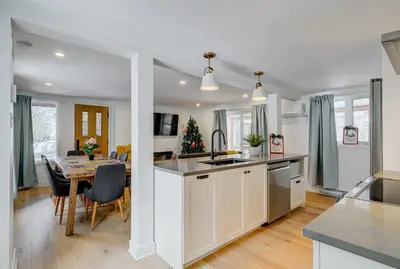 a kitchen and dining room with a dining table at 951A Shefford Bromont 3 bedrooms in Bromont