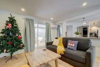 a living room with a christmas tree and a couch at 951A Shefford Bromont 3 bedrooms in Bromont