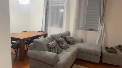 a living room with a couch and a table at Spacious Condo with a Bright Interior in Montréal