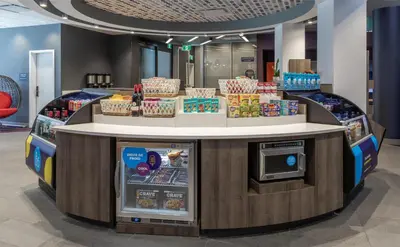 a food counter in a store with food on display at Tru By Hilton Montréal centre-ville in Montréal