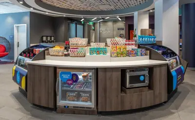 a food counter in a store with food on display at Tru By Hilton Montréal centre-ville in Montréal