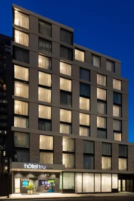 a hotel building with lights on at Tru By Hilton Montréal centre-ville in Montréal