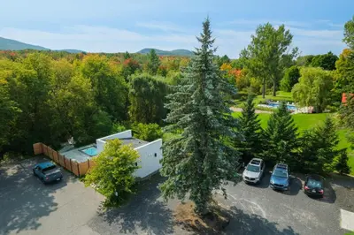 an aerial view of a parking lot with a tree at room with private bathroom 837 shefford suite 105 in Bromont