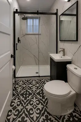 a bathroom with a shower and a toilet and a sink at Grand Appartement 4 Chambres Rénové et Meublé in Montréal