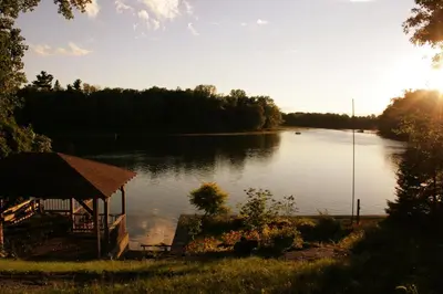 a view of a lake with a gazebo at Piece of heaven near Montreal in Saint-Marc-sur-Richelieu