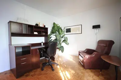 an office with a desk and a chair and a computer at Piece of heaven near Montreal in Saint-Marc-sur-Richelieu