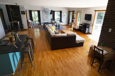 a living room with a couch and a table at Piece of heaven near Montreal in Saint-Marc-sur-Richelieu