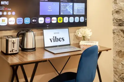 a desk with a laptop computer on top of it at Olympia Hotel by Lodgo in Montréal