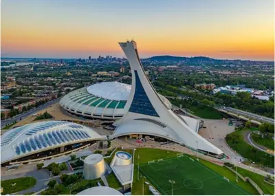 a view of a large building with a stadium at Appartement cosy au mois proche du Stade Olympique in Montréal