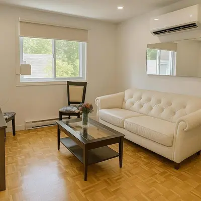 a living room with a couch and a coffee table at Chic 3BR Stay in Laval, Bright and Peaceful in Laval