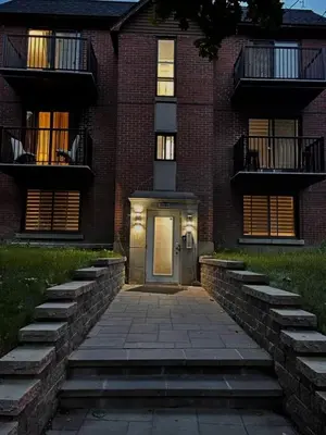 a brick building with a door in front of it at Bright Renovated 4BR, Heart of Côte-des-Neiges, Montreal in Montréal