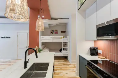 a kitchen with a sink and a counter top at Le Galeria, MTLVR in Montréal