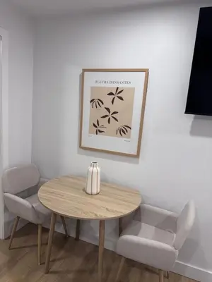 a table and two chairs in a room at Casa Samson in Laval