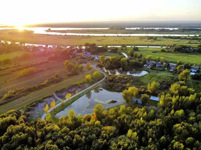 an aerial view of a park with a river at Chalet 1 cuisine - Domaine de l'Archipel in Sorel