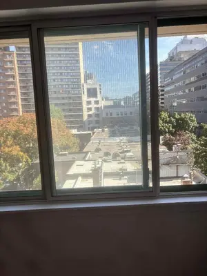 a view of a city from a window at Cozy 1BDR in Prime location - Walk to Everything in Montréal