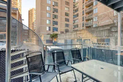 a row of chairs and tables on a balcony at Condo McGill University in Montréal