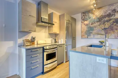 a kitchen with a sink and a stove top oven at Condo McGill University in Montréal