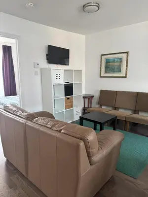 a living room with a couch and a table at Magnifique 2 chambre 2311#3M in Montréal