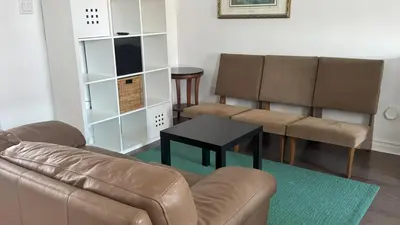 a living room with a couch and two chairs at Magnifique 2 chambre 2311#3M in Montréal