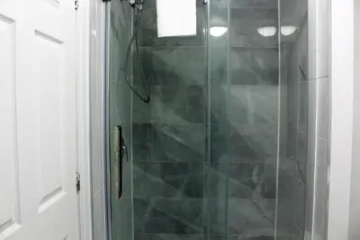 a bathroom with a shower with a glass door at Magnifique 2 chambre 2311#3M in Montréal