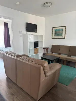 a living room with a couch and a table at Magnifique 2 chambre 2311#3M in Montréal