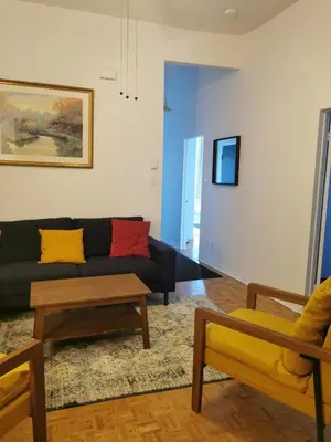 a living room with a couch and a table at Grand Appartement centre-ville 1227, 3 chambres in Montréal