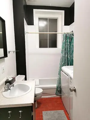 a bathroom with a sink and a toilet and a window at Appartement centre-ville Montréal 1215 LT in Montréal
